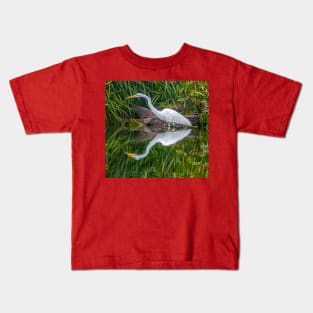 Reflections of Great White Egret looking for dinner Kids T-Shirt